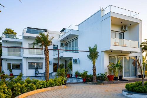 Bhiwadi Villa | ELIVAAS Signature AdhiVa 5-BHK Farmhouse with Private Pool, Bar & Lush Garden