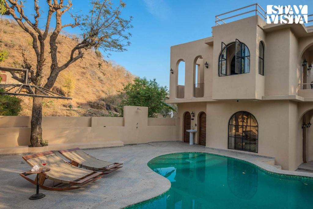 Bedla Villa | StayVista at Vanya Veda with Bathtub, Pool & Lawn