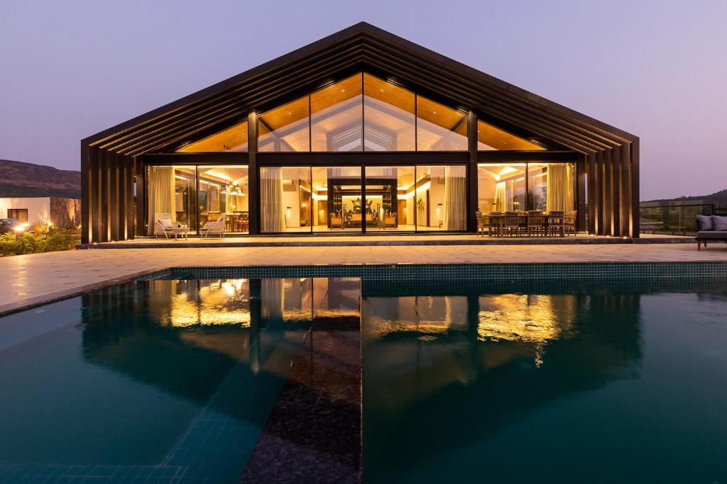 Lonavala Villa | StayVista's The Barn - Mountain-View Luxury Mansion with Heated Infinity Pool, Deck, Jacuzzi, Lawn featuring a Gazebo and Firepit