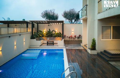 Khodala Villa | StayVista at Oriana Palms with Wifi and Pool