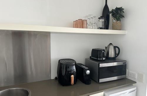 Nelly Bay Apartment | Blue on Blue Large One Bedroom Apartment, steps from ferry, amazing pool, wifi