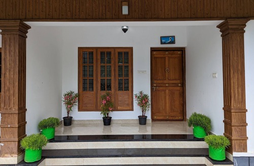 Irinjalakuda Villa | Cozy One Bedroom Villa Facing Paddy fields amidst a Fruit garden
