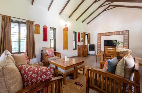 Nashik Villa | Farmhouse Retreat by StayVista - Classic architecture, Rustic interiors, Cozy rooms & A refreshing swimming pool