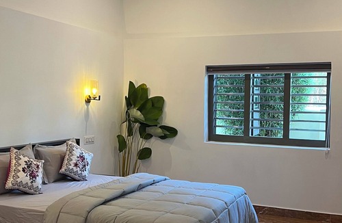 Thariyode House | Marvelous 2-bedroom bungalow, tranquility at our dam-facing Banasura Sagar Dam.