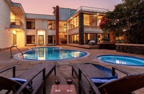 Nagaon Villa | Our Beloved Summer by StayVista - Offering a swimming pool, expansive lawn, badminton court and indoor games