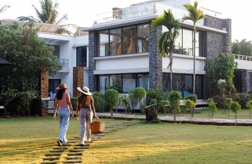 Nagaon Villa | Our Beloved Summer by StayVista - Offering a swimming pool, expansive lawn, badminton court and indoor games