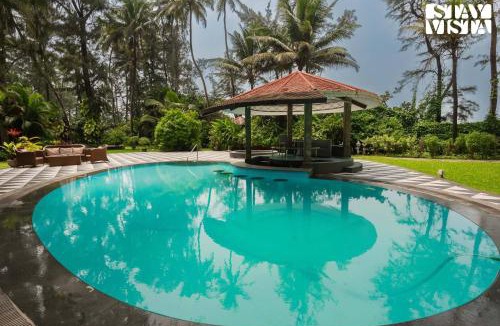 Nagaon Villa | Sea Breeze by StayVista - Beachside bliss with a splash of creativity with Pool, gazebo, lush lawn, and an artistically inspired house