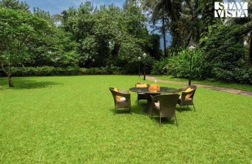 Nagaon Villa | Sea Breeze by StayVista - Beachside bliss with a splash of creativity with Pool, gazebo, lush lawn, and an artistically inspired house