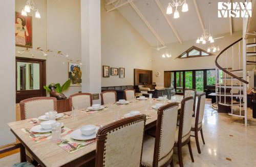 Nagaon Villa | Sea Breeze by StayVista - Beachside bliss with a splash of creativity with Pool, gazebo, lush lawn, and an artistically inspired house