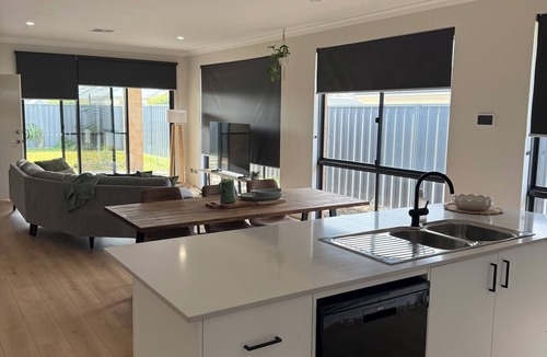 Singleton House | Seaside Escape Kick back and relax in this calm, stylish space.