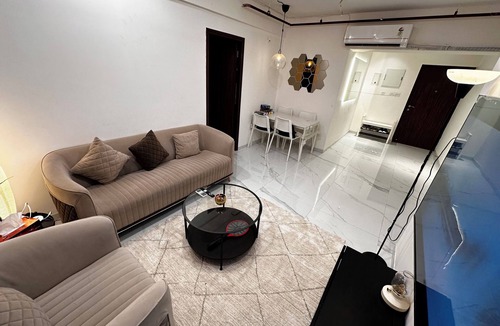 Goregaon West Apartment | Sky Oasis: Premium 2BHK I 65' TV, AC, High Floor, Andheri West