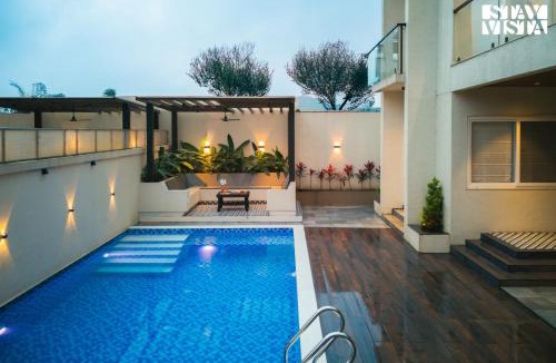 Khodala Villa | StayVista at Oriana Palms with Wifi and Pool