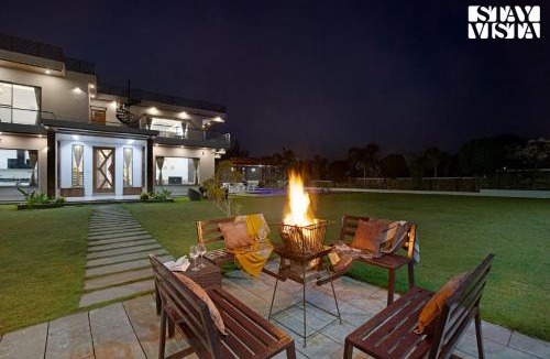 Bedla Villa | StayVista's Bella Dream - Mountain-View with Outdoor Pool, Lawn featuring a Gazebo & Indoor Games