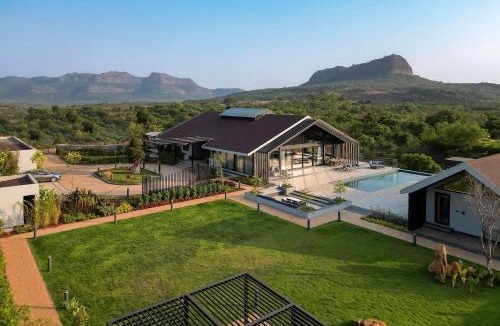 Lonavala Villa | StayVista's The Barn - Mountain-View Luxury Mansion with Heated Infinity Pool, Deck, Jacuzzi, Lawn featuring a Gazebo and Firepit