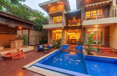 Kune Village Villa | StayVista's The Happy Hive - Cozy rooms and a pool for a delightful stay
