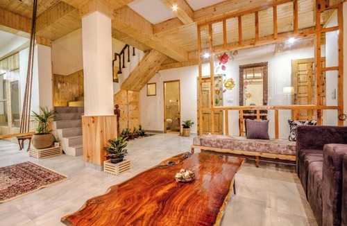 Manali Ski Chalet | Stone and wood cosy chalet admist apple garden with a beautiful law