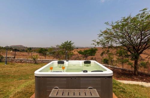 Nashik Villa | Stone House Bezze by StayVista with Lake view, Jacuzzi & Lawn - your perfect getaway