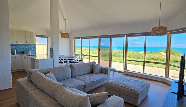 Beachfront retreat with breathtaking views steps from the shore. in Ledge Point
