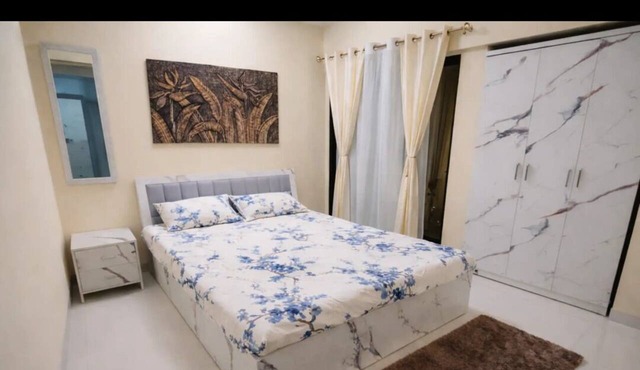 Bright balcony 2-bedroom apartment with AC in vibrant Thane/Mulund