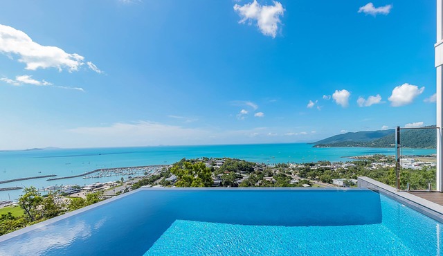 Relax in style as you overlook the Coral Sea and Whitsunday Islands beyond in Airlie Beach