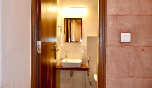 Deluxe Room 2nd floor with partial fort view and city view. 