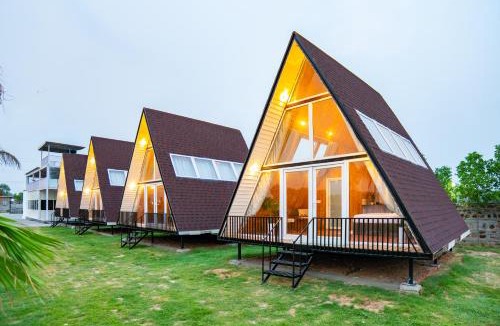 Faridabad Villa | ELIVAAS Signature Malik Farms Countryside Wooden Cottage on 2 Acre Estate with Shared Pool, Garden & Restaurant