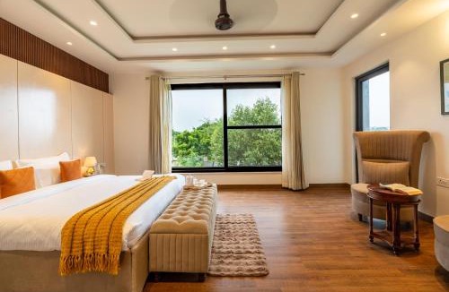 Bandhwari Villa | ELIVAAS Signature Gardenia 4-BHK Farmhouse with Private Pool, Game Zone, & Lush Garden