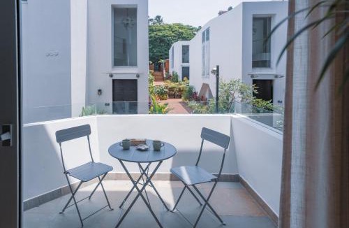 Nerul Apartment | El Volar by The Blue Kite - 2BHK, 5 Mins to Casino & 10 Mins to Candolim Beach with Big common Pool, Fully Equipped Kitchen, 24x7 Security, WiFi