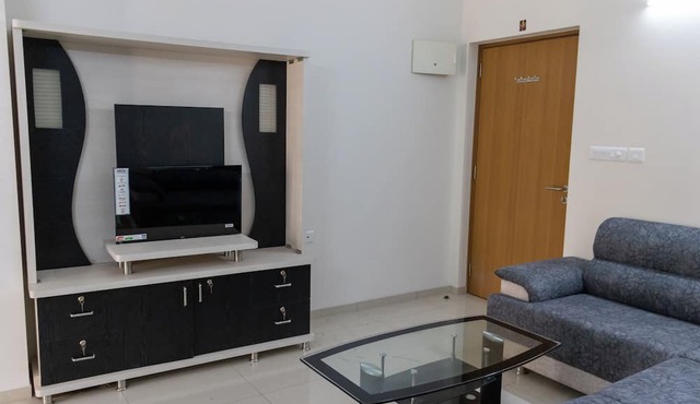 2-bedroom apartment in serene GIFT city with AC, Pool, Gym, Family/Business Stay