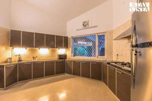 StayVista at Solitude in the Woods- 4BHK Villa with Private Pool, Kids Play area, Sohna