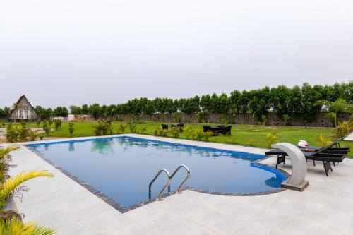 ELIVAAS Signature Malik Farms Countryside Wooden Cottage on 2 Acre Estate with Shared Pool, Garden & Restaurant