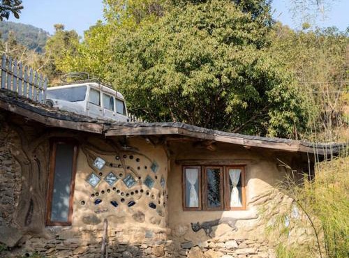 Hidden Earthen Home With An SUV Car As Entrance